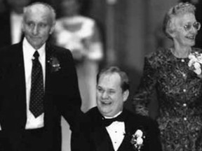 Cam Tait, seen with his parents at his wedding on Nov. 11, 1995.