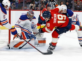 SUNRISE, FL - NOVEMBER 12: Goaltender Stuart Skinner #74 of the Edmonton Oilers stops a shot by Matthew Tkachuk #19 of the Florida Panthers during first period action at the FLA Live Arena on November 12, 2022 in Sunrise, Florida.