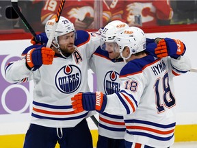 SUNRISE, FL - NOVEMBER 12: Warren Foegele #37 is congratulated by Zach Hyman #18 and Leon Draisaitl #29 of the Edmonton Oilers after Foegele scored a third period goal during the against of the Florida Panthers at the FLA Live Arena on November 12, 2022 in Sunrise, Florida.