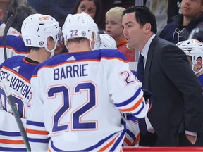 Head coach Jay Woodcroft of the Edmonton Oilers talks to players during the second period of a game against the Chicago Blackhawks  at United Center on Oct. 27, 2022, in Chicago, Illinois.