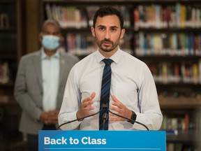 Ontario Education Minister Stephen Lecce speaks at a press conference for the Ontario Government at St. Robert Catholic High School in Toronto, Wednesday, Aug. 4, 2021.&ampnbsp;Ontario education workers such as librarians, custodians and early childhood educators have agreed to mediation with the government in contract talks that have inched toward a strike.