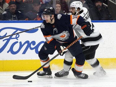 The Edmonton Oilers' Zach Hyman (18) battles the Los Angeles Kings' Phillip Danault (24) during first period NHL action at Rogers Place in Edmonton, Wednesday Nov. 16, 2022.