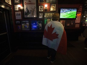 A Canadian soccer fan watches the Team Canada and Team Croatia World Cup match at The Pint Whyte, 8032 104 St., in Edmonton Sunday Nov. 27, 2022. Croatia won 4-1. Photo By David Bloom