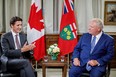 Canada's Prime Minister Justin Trudeau speaks with Ontario Premier Doug Ford at Queen's Park provincial legislature in Toronto, Ontario, on Aug. 30, 2022.
