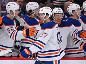 Nov 30, 2022; Chicago, Illinois, USA;  Edmonton Oilers forward Connor McDavid (97) celebrates with the bench after scoring a goal in the third period against the Edmonton Oilers at United Center. Edmonton defeated Chicago 5-4.