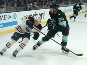 James Hamblin (left), a product of the Southside Athletic Club bantam AAA Lions, has made it to the NHL. Pictured here during the pre-season, Hamblin made his regular-season debut with the Oilers last night against the Panthers. Elaine Thompson/AP photo