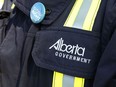 An Alberta Occupational Health and Safety officer stands at a press conference on Monday May 12, 2014 in Edmonton Alta. Tom Braid/Edmonton Sun/QMI Agency