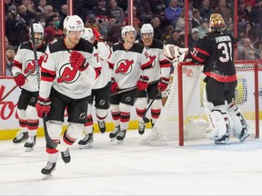 New Jersey Devils centre Jesper Boqvist (70) skates to the bench after scoring against Ottawa Senators goalie Anton Forsberg in the second period at the Canadian Tire Centre.