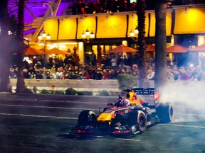 A Formula 1 racing team car from Oracle Red Bull Racing burns out on the Las Vegas Strip during the Las Vegas Grand Prix Launch Party, ahead of the 2023 Inaugural Las Vegas Grand Prix, at Caesars Palace, in Las Vegas, Nevada, on November 5, 2022. -