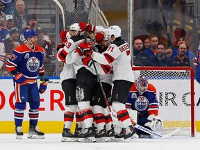 The New Jersey Devils celebrate a goal by forward Jesper Brett (63) during the third period against the Edmonton Oilers at Rogers Place, Thursday, Nov. 3, 2022.