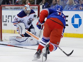 Edmonton Oilers goaltender Jack Campbell (36) saves against New York Rangers center Vincent Trocheck (16) during the third period at Madison Square Garden on Saturday, November 26, 2022.