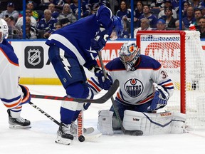 Edmonton Oilers goaltender Jack Campbell (36) makes a save in front of Tampa Bay Lightning left wing Alex Killorn (17) during the third period at Amalie Arena on Nov. 8, 2022.