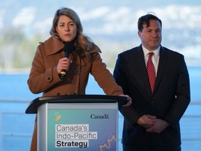 Minister of Foreign Affairs Melanie Joly, front left, responds to questions as Minister of Public Safety Marco Mendicino listens during a news conference to announce Canada's Indo-Pacific strategy in Vancouver on Sunday, Nov. 27, 2022. Agriculture commodity groups are applauding the Liberal government's long-awaited Indo-Pacific strategy and hoping it will lead to more, and better, free trade deals.
