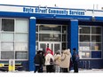 People line up to enter Boyle Street Community Services in Edmonton, on Saturday, Dec. 25, 2021.