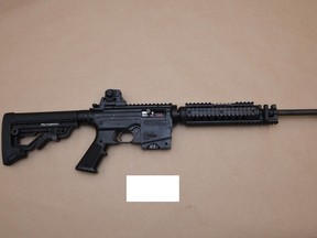 Edmonton police said officers seized a firearm and weapons after searching an SUV connected to a weapons complaint and robbery reported on Dec. 8, 2022.