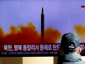 A man watches a TV broadcasting a news report on North Korea firing a ballistic missile off its east coast, in Seoul, South Korea, December 18, 2022.