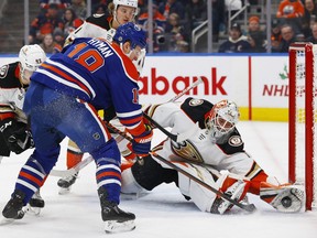 Ducks goaltender Lucas Dostal makes a save on Oilers forward Zach Hyman on Saturday night.