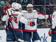 Washington Capitals forward Alex Ovechkin (8) celebrates with forward Dylan Strome, left, after defenceman Martin Fehervary (42) scored a goal during the first period against the Seattle Kraken at Climate Pledge Arena on Dec. 1, 2022.
