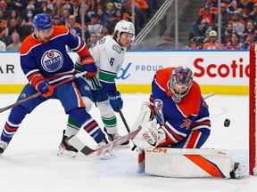 Vancouver Canucks forward Brock Boeser (6) looks for a rebound in front of Edmonton Oilers goaltender Stuart Skinner (74) during the second period at Rogers Place. Perry Nelson-USA TODAY Sports