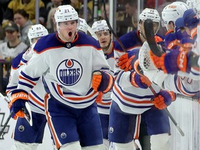 LAS VEGAS, NEVADA - JANUARY 14: Klim Kostin #21 of the Edmonton Oilers celebrates with teammates on the bench after scoring a second-period goal against the Vegas Golden Knights during their game at T-Mobile Arena on January 14, 2023 in Las Vegas, Nevada.