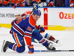 Edmonton Oilers defencemen Philip Broberg (86) reacts after being hit in the face with a puck against the Colorado Avalanche during the second period at Rogers Place.