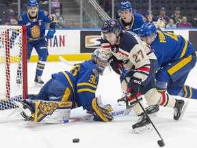 Edmonton Oil Kings goalie Kolby Hay makes a stop on Cole Shepard of the Lethbridge Hurricanes at Rogers Place in  Edmonton on Sunday, Jan. 29, 2023.