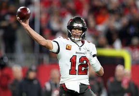 Tampa Bay Buccaneers quarterback Tom Brady (12) drops back to pass against the Dallas Cowboys during a wild card game at Raymond James Stadium.