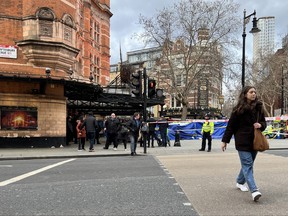 Firefighters and emergency services attend an emergency outside the Palace Theatre in Cambridge Circus on Jan. 27, 2023 in London, England. According to the Met Police, the man was working on a telescopic urinal at site at Cambridge Circus and has now reportedly died of his injuries.