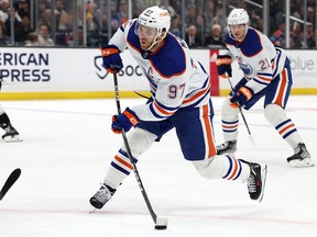 Jan 9, 2023; Los Angeles, California, USA; Edmonton Oilers center Connor McDavid (97) shoots and scores during the third period against the Los Angeles Kings at Crypto.com Arena.