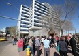 Workers stand outside the John E. Brownlee Building, where Alberta Justice is based, at 10365-97 St., on May 11, 2015.