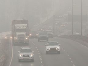 Traffic heads east through thick fog on Whitemud Drive just past Edmonton's Rainbow Valley Bridge, Tuesday Jan. 10, 2023. Environment Canada issued a special air quality statement for Edmonton and surrounding areas. Photo By David Bloom