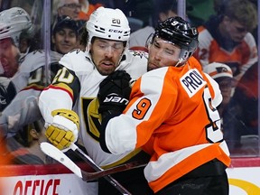 Philadelphia Flyers' Ivan Provorov, right, and Vegas Golden Knights' Chandler Stephenson collide during the third period of an NHL hockey game, Tuesday, March 8, 2022, in Philadelphia. The NHL says players are free to decide which team initiatives they support.