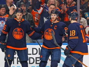 The Edmonton Oilers celebrate a goal scored by forward Connor McDavid, center, during the first period against the Seattle Kraken at Rogers Place on Jan. 17, 2023.