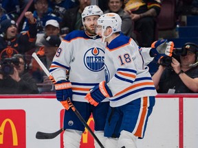 Edmonton Oilers forward Leon Draisaitl (29) and forward Zach Hyman (18) celebrate Draisaitl's goal against the Vancouver Canucks in the second period at Rogers Arena on Jan. 21, 2023.