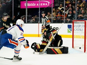 Jan 14, 2023;  Las Vegas, Nevada, USA;  Edmonton Oilers center Klim Kostin (21) scores a goal against Vegas Golden Knights goaltender Logan Thompson (36) during the second period at T-Mobile Arena.  Mandatory Credit: Lucas Peltier-USA TODAY Sports