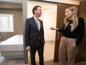 Taylor Soroka, Jasper Place Wellness Centre (JPWC) Co-Founder and Vice President of Strategy and Engagement, gives Health Minister Jason Copping a tour of a new 36 transition bed facility referred to as the Bridge Healing Transitional Accommodation Program, 16022 100 Ave., in Edmonton Thursday Jan. 12, 2023. Photo By David Bloom