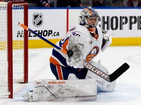 New York Islanders' goalie Ilya Sorokin (30) makes a blocker save against the Edmonton Oilers during first period NHL action at Rogers Place, in Edmonton Thursday Jan. 5, 2023.