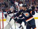 Dylan Holloway (55) of the Edmonton Oilers attempts to get past Vladislav Gavrikov (4) of the Columbus Blue Jackets in the first half at Rogers Place in Edmonton on January 25, 2023.  