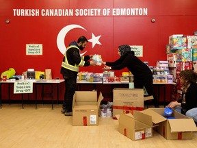 Members of the Turkish Canadian Society of Edmonton gather supplies at the organization's cultural centre (15450 105 Ave.) to send to Turkey following earthquakes on Monday.