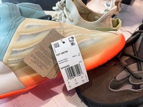 A pair of Yeezy shoes are seen in a Foot Locker store on the day Adidas terminated its partnership with the American rapper and designer Kanye West, now known as Ye, in Garden City, New York, October 25, 2022.