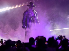 World Wrestling Entertainment star The Undertaker makes his way to the ring during a match at the World Wrestling Entertainment (WWE) Super Showdown event in the Saudi Red Sea port city of Jeddah late on January 7, 2019.