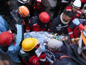 Rescuers help Hediye, 16, from Syria, who survived a deadly earthquake in Kahramanmaras, Turkey February 11, 2023.