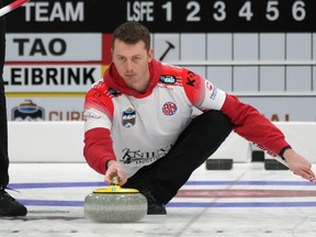 Skip Kyler Kleibrink delivers a rock during the first draw of the men's provincial curling championship at the River Cree Resort and Casino twin rinks in Enoch on Wednesday, Feb. 8, 2023.