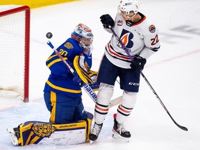 Edmonton Oil Kings  goalie Kolby Hay (30) loses sight of the puck as Kamloops Blazers Daylan Kuefler (22) watches the puck fly past the net during first period WHL action on Monday, Feb. 20, 2023 in Edmonton.