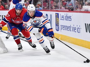 Philip Broberg #86 of the Edmonton Oilers skates with the puck against Jonathan Drouin #27 of the Montreal Canadiens on Feb. 12, 2023, in Montreal. Broberg is looking forward to having another Swede on the team.