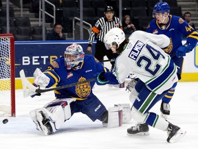 The Swift Current Broncos' Josh Filmon (24) scores on the Edmonton Oil Kings' Kolby Hay (30) at Rogers Place, in Edmonton on Dec. 16, 2022.