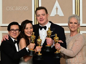 (From L) Best Actor in a Supporting Role US-Vietnamese actor Ke Huy Quan, Best Actress in a Leading Role Malaysian actress Michelle Yeoh, Best Actor in a Leading Role US actor Brendan Fraser, and Best Actress in a Supporting Role winner US actress Jamie Lee Curtis poses with their Oscar trophies in the press room during the 95th Annual Academy Awards at the Dolby Theatre in Hollywood, California on March 12, 2023. (Photo by FREDERIC J. BROWN/AFP via Getty Images)