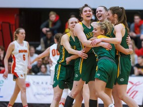 The University of Alberta Pandas celebrate winning the Canada West final over the University of Calgary Dinos, 76-65, at Jack Simpson Gym on Saturday, March 4, 2023.