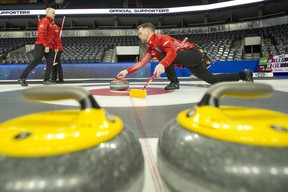 Team Canada's Brad Gushue throws a rock during practice for the Tim Hortons Brier at Budweiser Gardens in London, Ont., Friday.