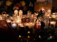 Candles are lit during a vigil outside a Mexican immigration facility where at least 38 migrants died in a fire, in Ciudad Juarez, Tuesday, March 28, 2023.Getty Images